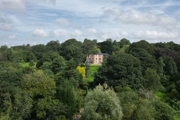 Lough Sillan House nestled among 9.5 acres of lakeside gardens and woodland.