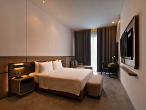 Grand Deluxe | Minibar, escritorio, wifi gratis y ropa de cama 