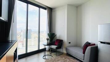 Luxury Condo, Sea View | Living area | 55-inch Smart TV with digital channels, Netflix, streaming services