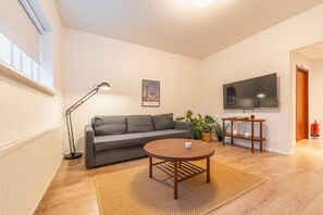 Apartment, 1 Bedroom, Garden View | Living area | 20-inch LCD TV with cable channels - Day Dream Soleyjargata Apartments (Reykjavik)
