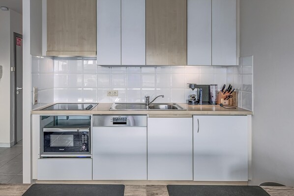 Fridge, microwave, coffee/tea maker, toaster