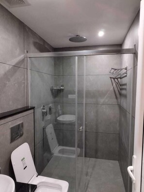 Classic Studio Suite | Bathroom | Shower, slippers, towels, soap - The Wild Trails Clarks Exotica Munnar (Devikolam)