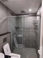Classic Studio Suite | Bathroom | Shower, slippers, towels, soap