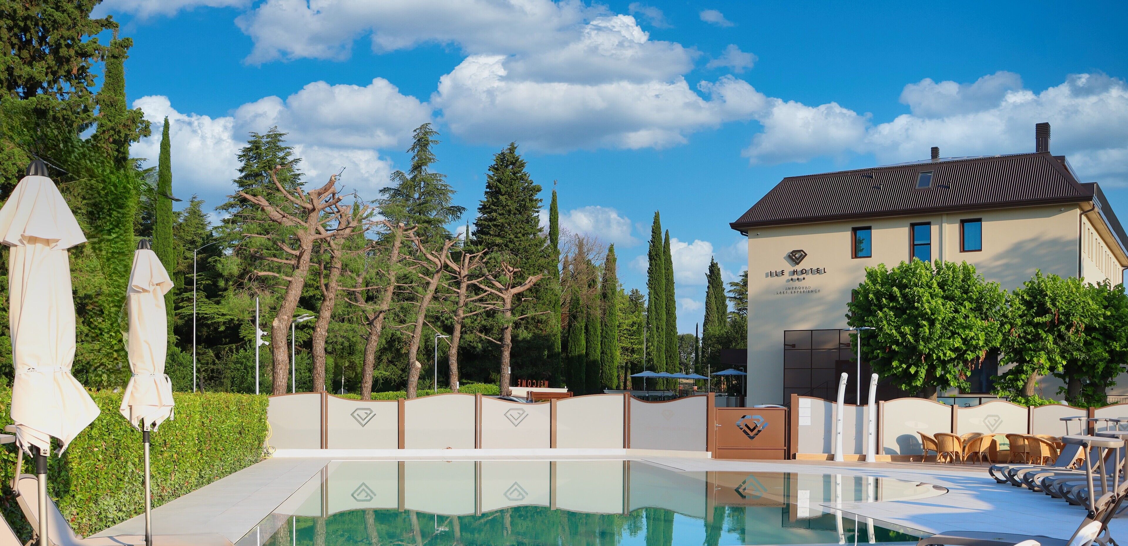 Seasonal outdoor pool, open 10:00 AM to 7:00 PM, pool umbrellas