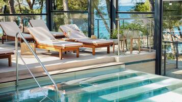 Indoor pool, outdoor pool, pool umbrellas, pool loungers