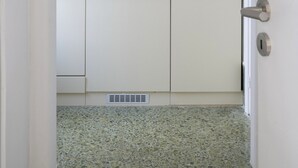 A small kitchenette with a sink, a coffee maker, and a bowl of fruit. - Central Athenian Penthouse Acropolis (Athens)