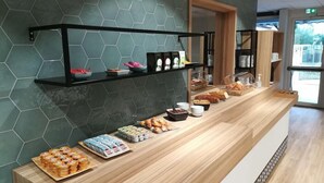 A breakfast buffet with various food items and condiments. - Kyriad Direct Valence Nord Bourg Les Valence (Bourg-les-Valence)