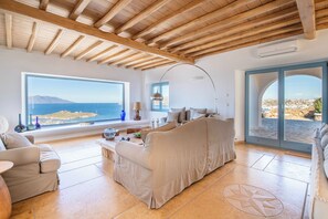 Gran Kanalia Villa Mykonos | Living room | 45-inch flat-screen TV with satellite channels, fireplace - Gran Kanalia Villa Mykonos (Mykonos)