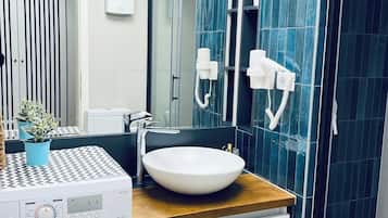 Hair dryer, towels, soap, shampoo