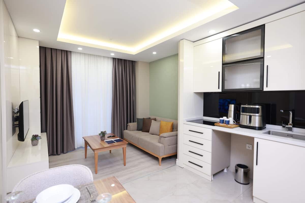 Junior Suite | 1 bedroom, desk, laptop workspace, iron/ironing board