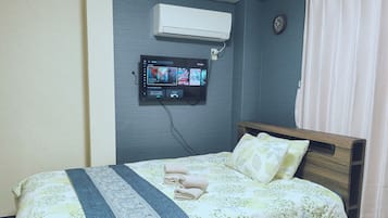 Business Studio | Premium bedding, desk, blackout drapes, iron/ironing board