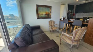 Apartment | Living area | Flat-screen TV - Oceana Suites Reñaca Norte (Vina del Mar)