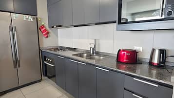 Apartment | Private kitchen | Fridge, microwave, oven, electric kettle
