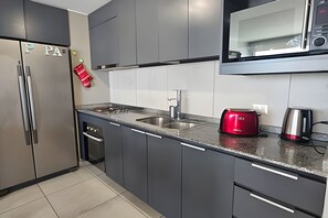 Apartment | Private kitchen | Fridge, microwave, oven, electric kettle