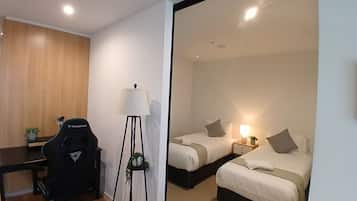 1 bedroom, desk, iron/ironing board, travel crib