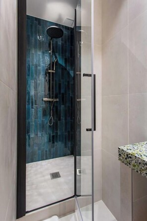 Shower, hair dryer, towels, soap