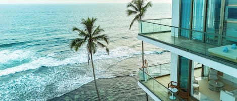 On the beach, white sand, sun-loungers, beach umbrellas