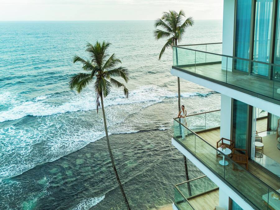 On the beach, white sand, sun-loungers, beach umbrellas