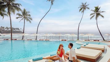 2 outdoor pools, open 7:00 AM to 9:00 AM, pool umbrellas, sun loungers