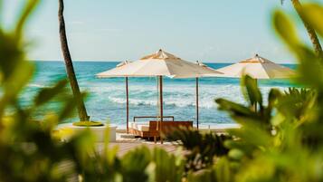 2 outdoor pools, open 7:00 AM to 9:00 AM, pool umbrellas, pool loungers