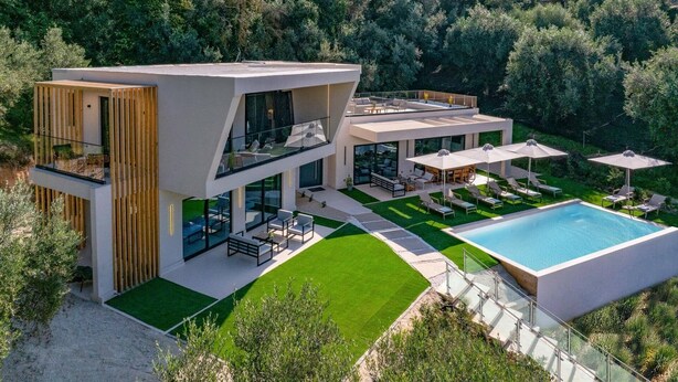 A modern two-story house with a swimming pool, outdoor seating, and a well-maintained lawn. - Villa Optima by Villa Plus (Ionian Islands)
