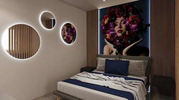 A modern bedroom with a bed, circular wall lights, and a large floral artwork.