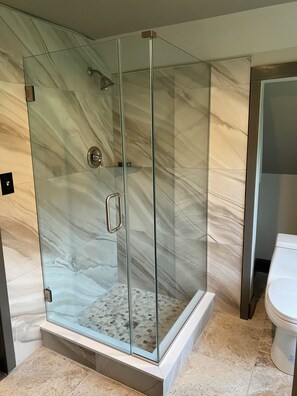 Shower, hair dryer, towels, soap
