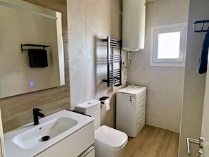 A bathroom with a sink, toilet, and towel rack. - Ten Days - App 3 - 'Anaga' with Sea View, Wi-Fi and Air Conditioning (La Orotava)