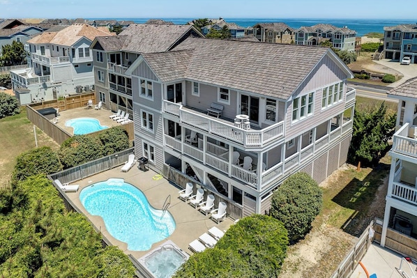 Enjoy ocean views from the second-floor balcony, surrounded by a pool and hot tub.