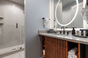 Shower, hair dryer, towels, soap - 2BR Downtown Views in Prime Location | The Mayfair (New Orleans)