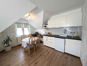 Fridge, microwave, stovetop, coffee/tea maker