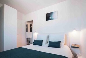 1 bedroom, desk, iron/ironing board, travel crib