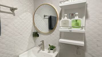 Hair dryer, towels, soap, shampoo