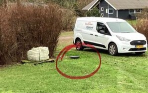 A white van parked on a grassy area with a house in the background. - 4 Star Holiday Home in Hals (Hals)