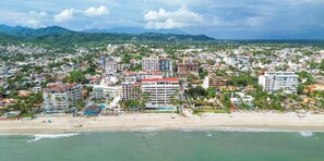 A coastal cityscape with a beach, hotels, and residential buildings. - Maralma 903: Panoramic Views and Rooftop Pool (Bucerías)