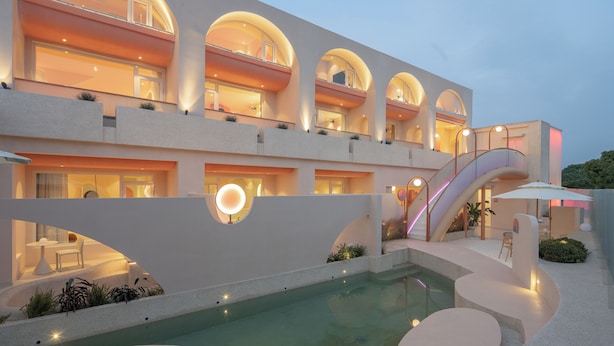 A modern hotel with multiple balconies, a swimming pool, and a staircase. - Qi Meng Rainbow bridge branch (Shanghai)