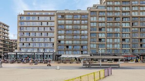 A beachfront hotel with multiple balconies, outdoor seating, and a casino. - 2 bedroom accommodation in Nieuwpoort (Nieuwpoort)