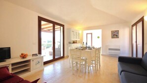Superior Villa | Living area | 24-inch flat-screen TV with satellite channels - Villas with common or private pool in Costa Rei (Muravera)
