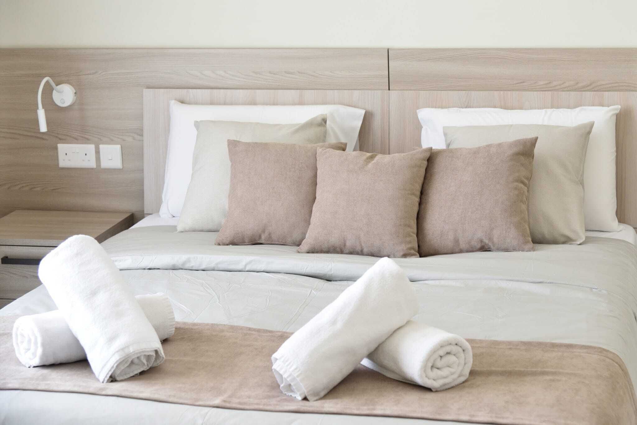 Frette Italian sheets, premium bedding, down comforters, desk