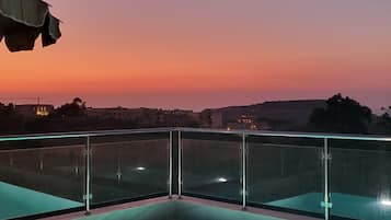 Seasonal outdoor pool, open 9:30 AM to 9:00 PM, pool umbrellas