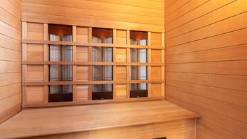 A wooden interior with a built-in bench and a wall-mounted shelf unit.