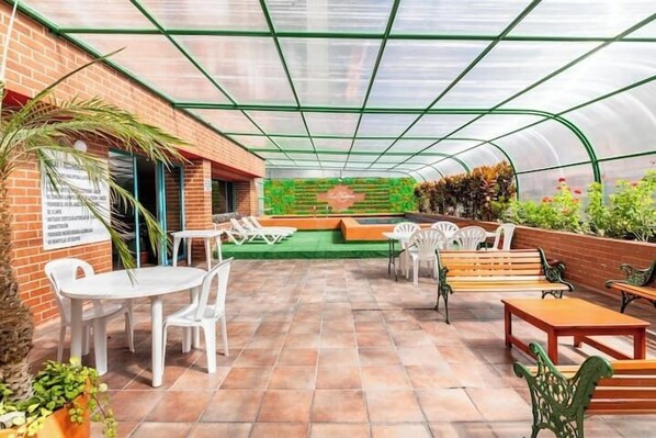 Indoor pool, open 9:00 AM to 8:00 PM, pool loungers