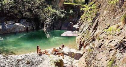 Holiday home Situated in a quiet location in the mountains on the edge of the river with a view of the forest