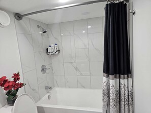 Hair dryer, towels, soap, shampoo - Contemporary Two Bedroom Basement Suite. (Edmonton)