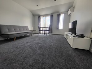 Junior Suite, Courtyard View | Living area | 32-inch LED TV with digital channels