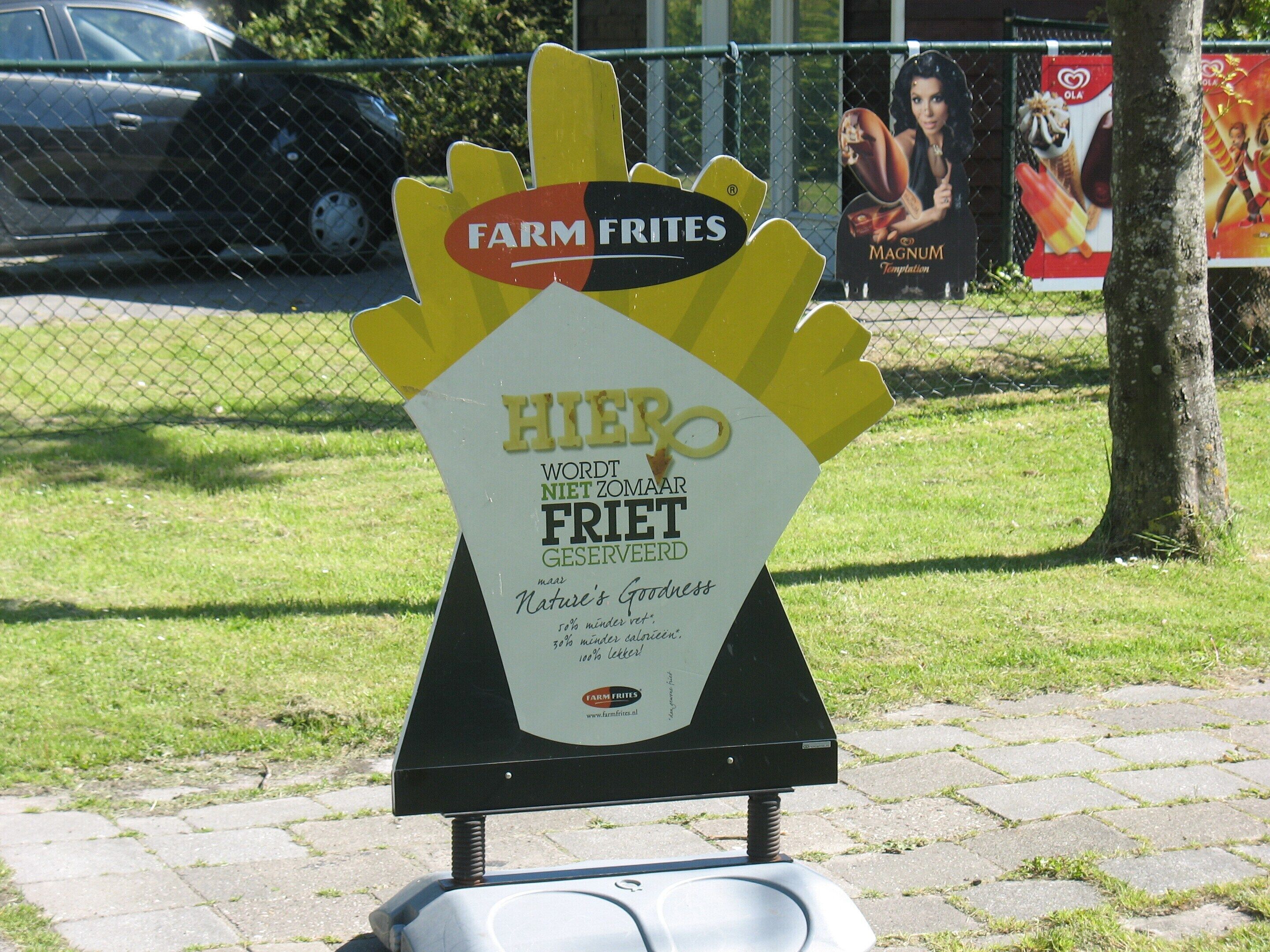 A sign for Farm Fries advertising a 30% discount on fries.