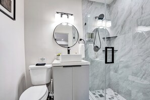 Shower, hair dryer, towels, soap