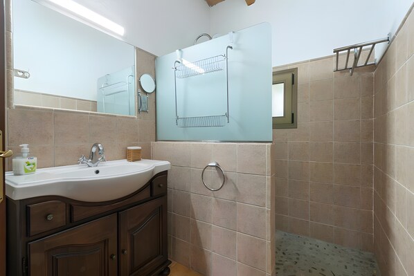 A bathroom with a sink, mirror, towel rack, and tiled walls. - Country House 'Cati Ref 57' with Private Pool, Wi-Fi and Air Conditioning (Son Servera)