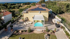 A Mediterranean-style villa with a swimming pool, terraced garden, and a view of the sea. - Ammentos by Interhome (Marina di Sorso)