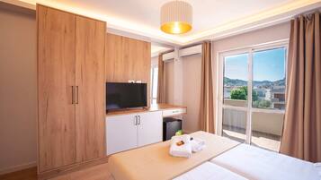 Deluxe Double Room, Balcony, City View | 1 bedroom, in-room safe, soundproofing, iron/ironing board